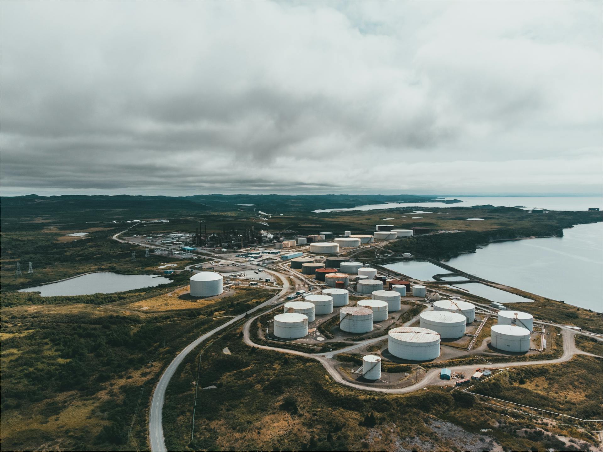 Aerial view of industrial storage tanks and petrochemical infrastructure along the Gulf Coast corridor